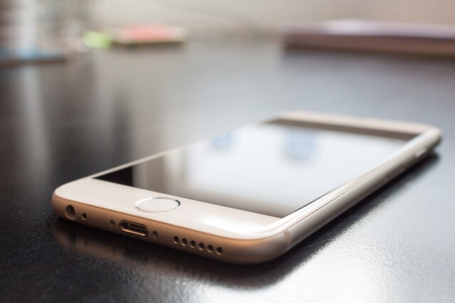 Mobile phone is being used for a mobile crowdfunding campaign.